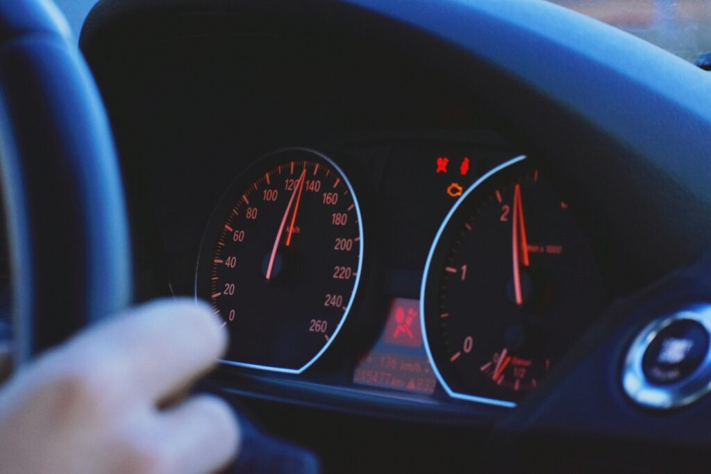 pexels-photo-3791193-3791193 A detailed view of a car's speedometer and dashboard, emphasizing speed and technology.